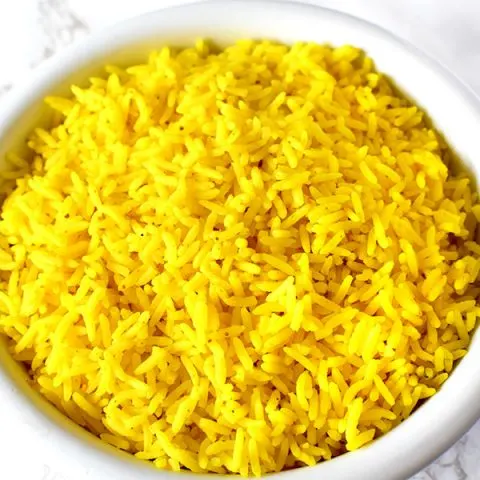 Yellow rice in a white bowl