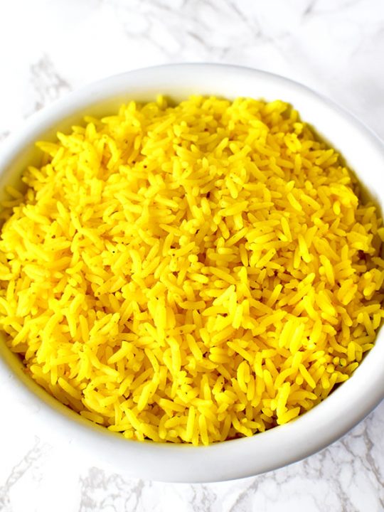 Yellow rice in a white bowl