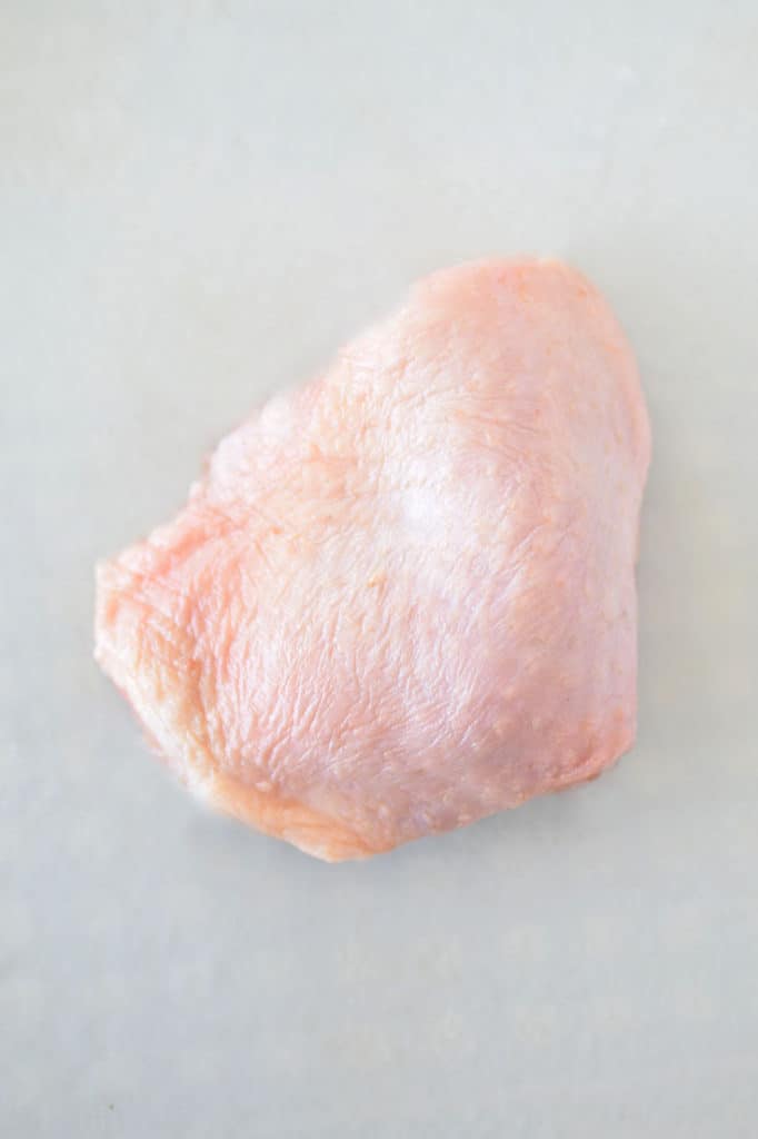 Raw chicken thigh