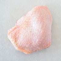 Thumbnail of a raw chicken thigh