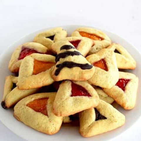 Jelly and chocolate hamantaschin on a plate