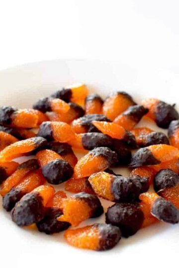 A pile of candied kumquats dipped in chocolate