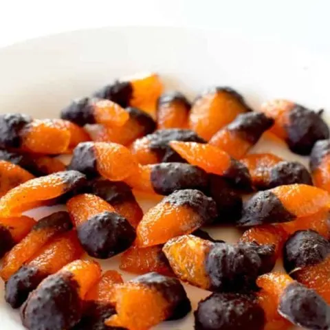 A pile of candied kumquats dipped in chocolate