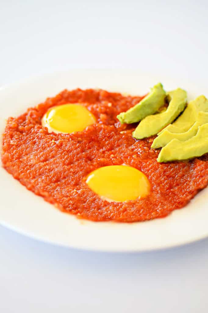 Huevos Rancheros with a side of avocado