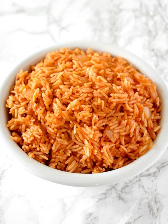 israeli red rice in a white bowl