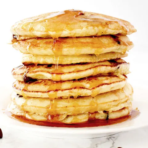 stack of dairy free chocolate chip pancakes on a white plate