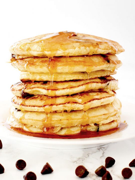 stack of dairy free chocolate chip pancakes on a white plate