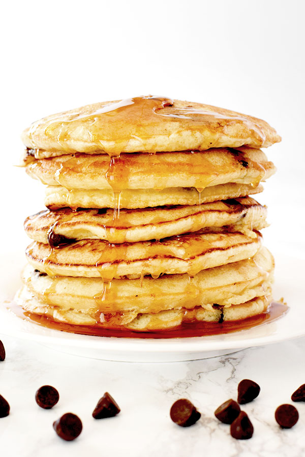 stack of dairy free chocolate chip pancakes on a white plate