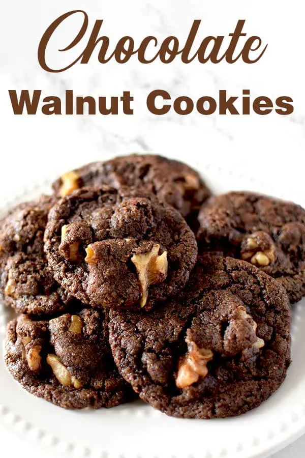 chocolate walnut cookies piled on a plate