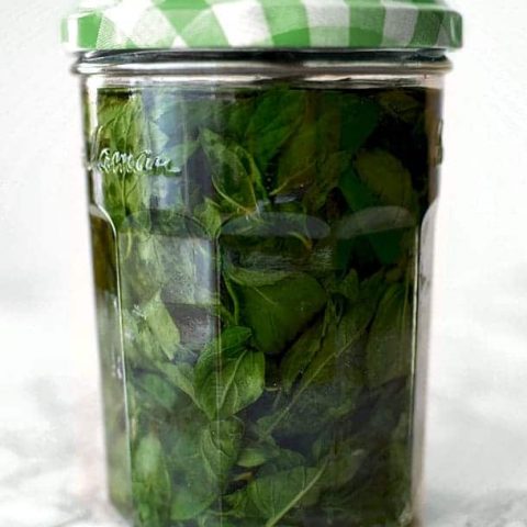 mint extract in a glass jar with a green lid