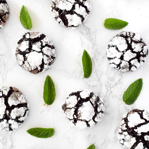 mint chocolate crinkle cookies with mint leaves