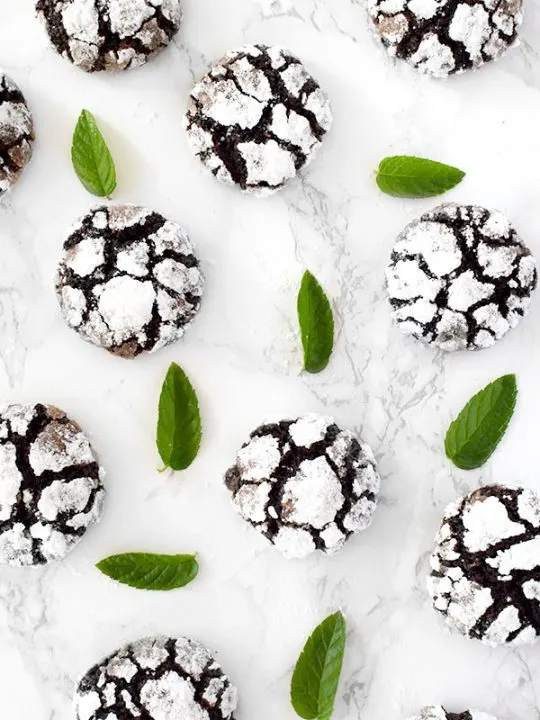mint chocolate crinkle cookies with mint leaves