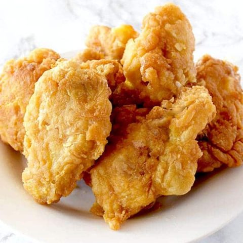 a pile of fried chicken wings on a plate