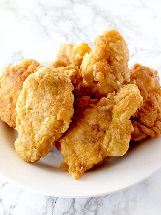 a pile of fried chicken wings on a plate