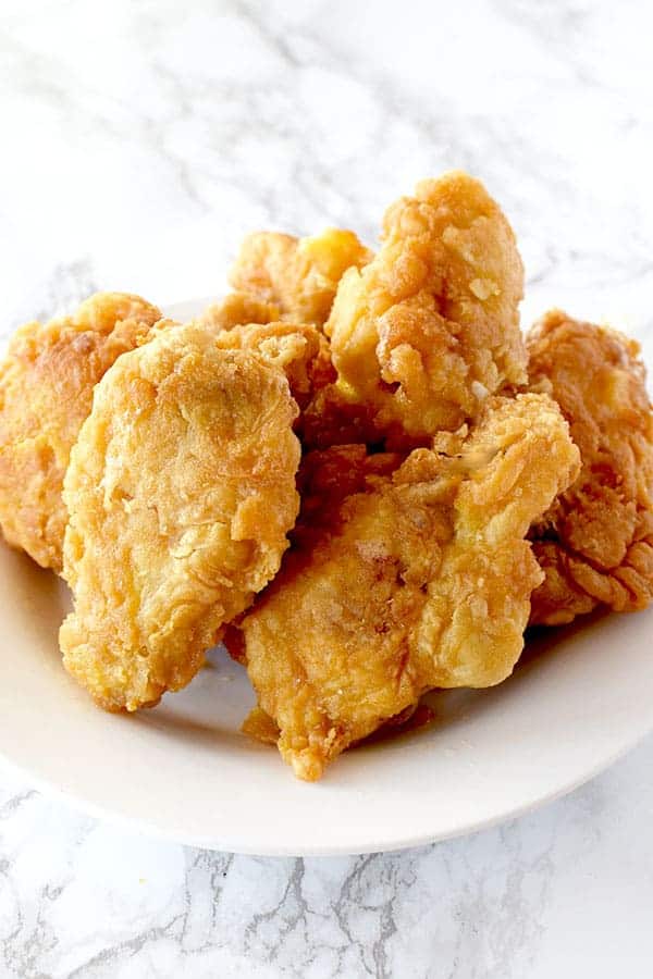 a pile of fried chicken wings on a plate