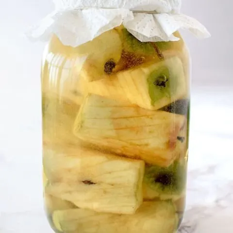 apple cores in a glass jar to make apple cider vinegar