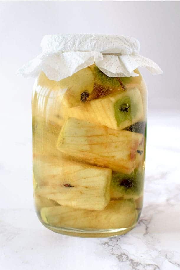 apple cores in a glass jar to make apple cider vinegar