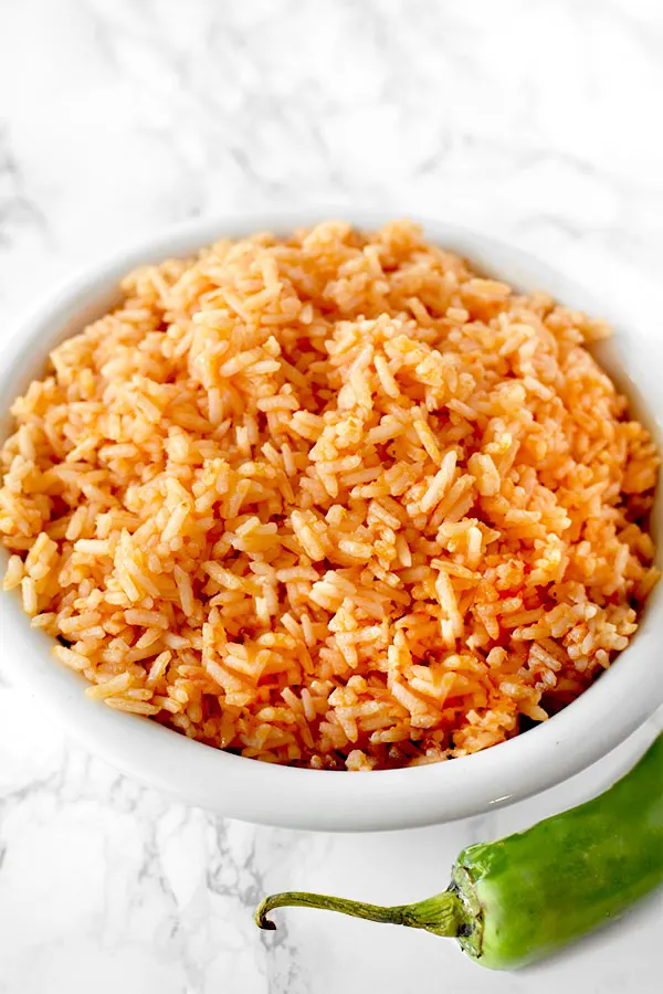 arroz rojo in a bowl on a marble counter