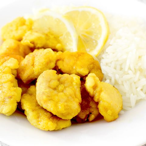 Chinese lemon chicken on a plate with rice