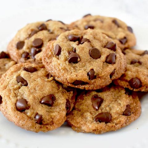 a pile of chocolate chip cookies on a plate