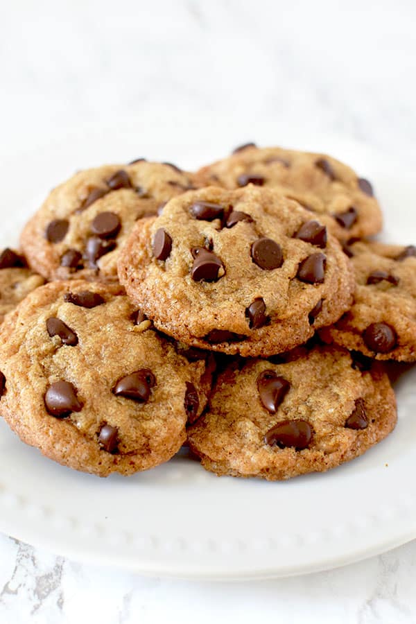 a pile of chocolate chip cookies on a plate