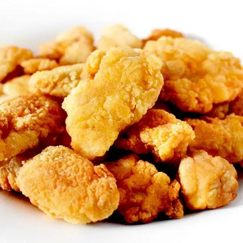 Popcorn chicken piled up on a plate