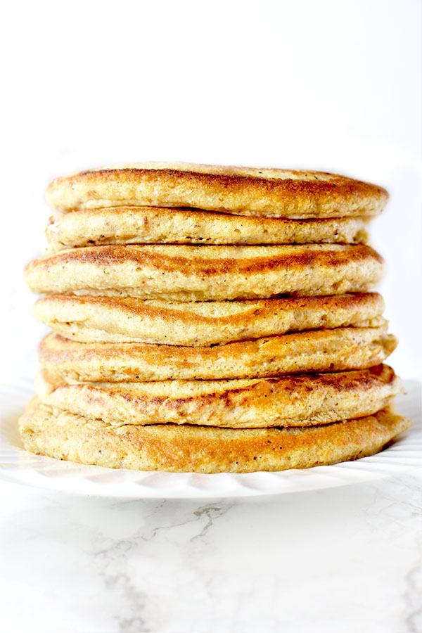 Stack of Passover Pancakes on a white plate sitting on a white marble counter