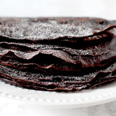 Gluten free Passover chocolate crepes sprinkled in powdered sugar