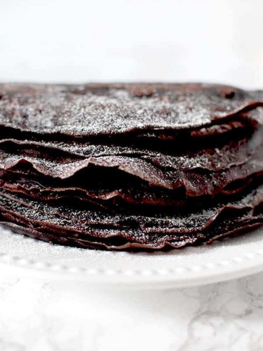 Gluten free Passover chocolate crepes sprinkled in powdered sugar
