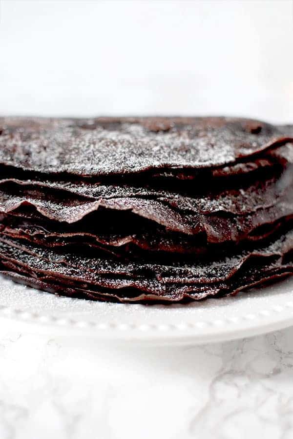 Gluten free Passover chocolate crepes sprinkled in powdered sugar