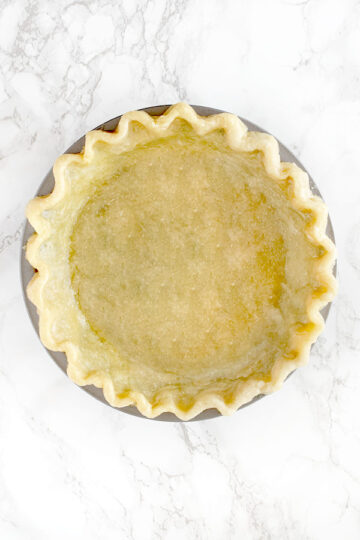 Pie crust made with oil on a white marble counter