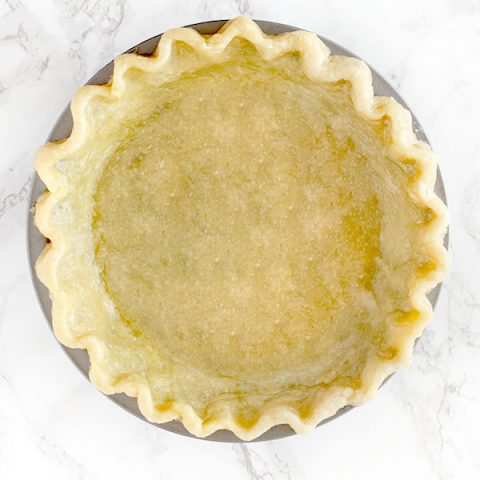 Pie crust made with oil on a white marble counter