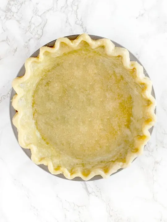 Pie crust made with oil on a white marble counter