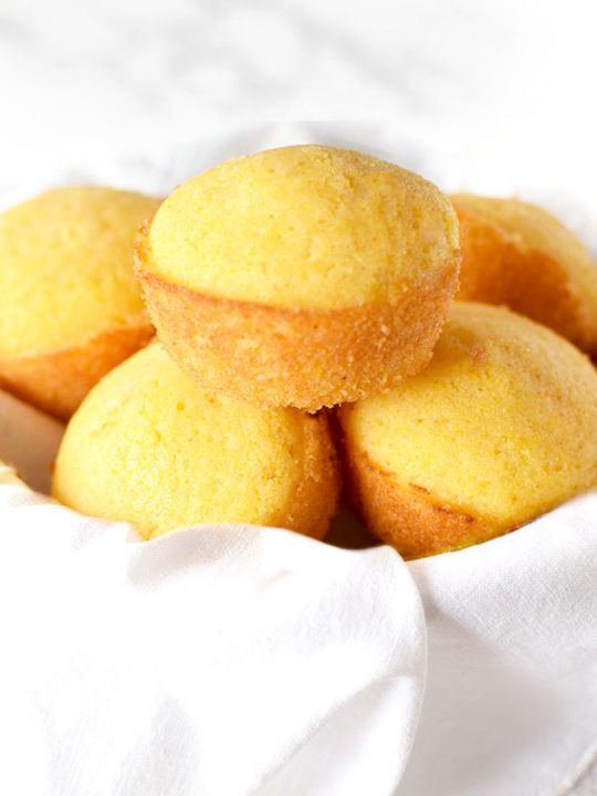 Southern cornbread muffins stacked in a bowl