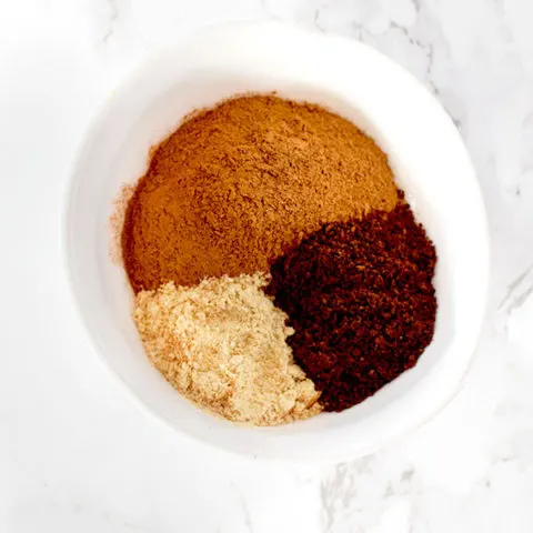 cinnamon, ginger, and cloves in a bow from pumpkin spice mix