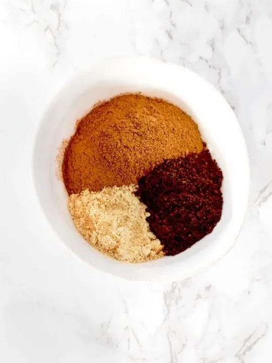 cinnamon, ginger, and cloves in a bow from pumpkin spice mix