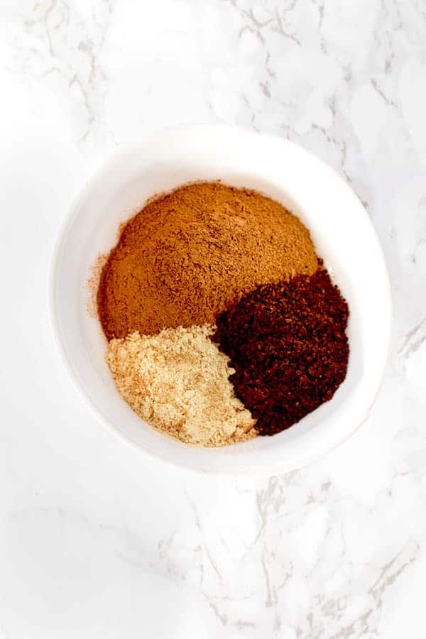 cinnamon, ginger, and cloves in a bow from pumpkin spice mix