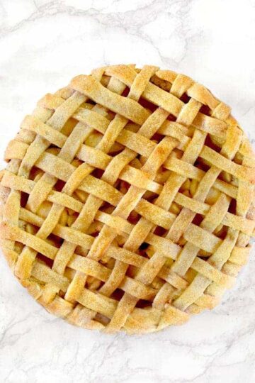 Apple pie on a white marble counter