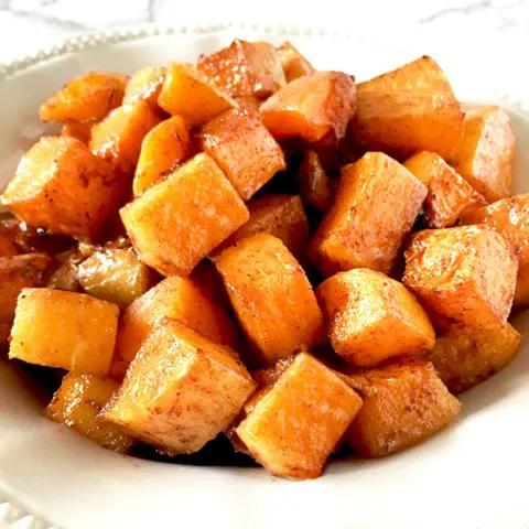 cubes cinnamon and brown sugar roasted butternut squash on a plate