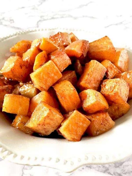 cubes cinnamon and brown sugar roasted butternut squash on a plate