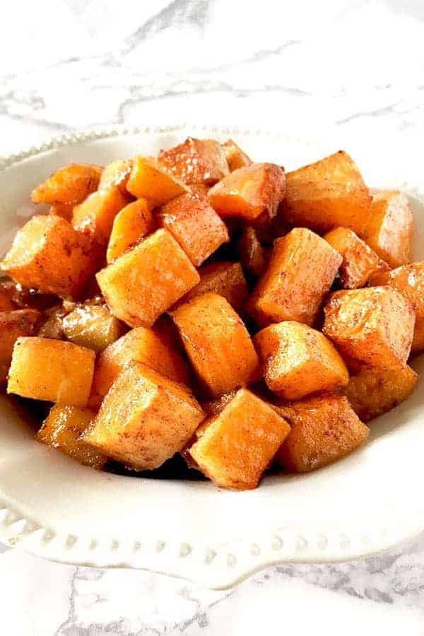 cubes cinnamon and brown sugar roasted butternut squash on a plate