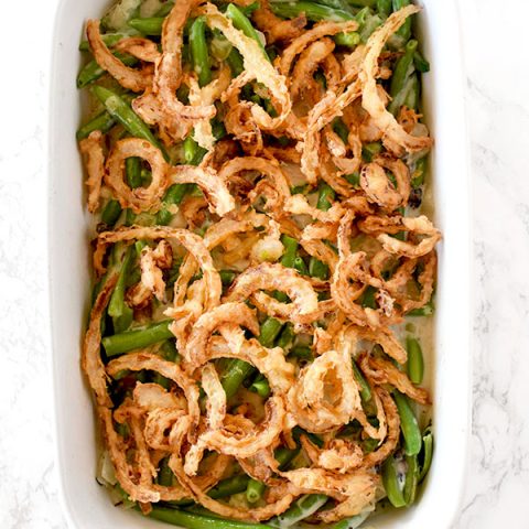 Dairy free green bean casserole on a white marble counter