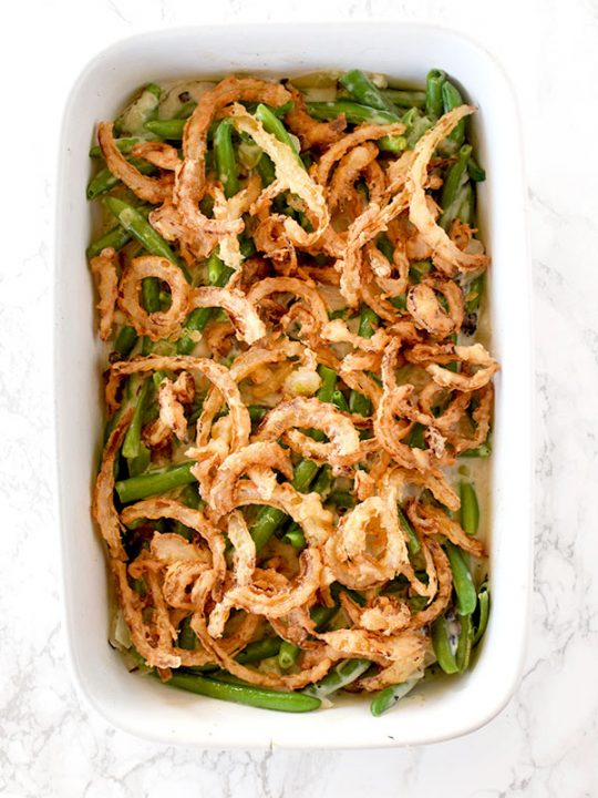 Dairy free green bean casserole on a white marble counter