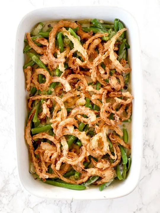 Dairy free green bean casserole on a white marble counter