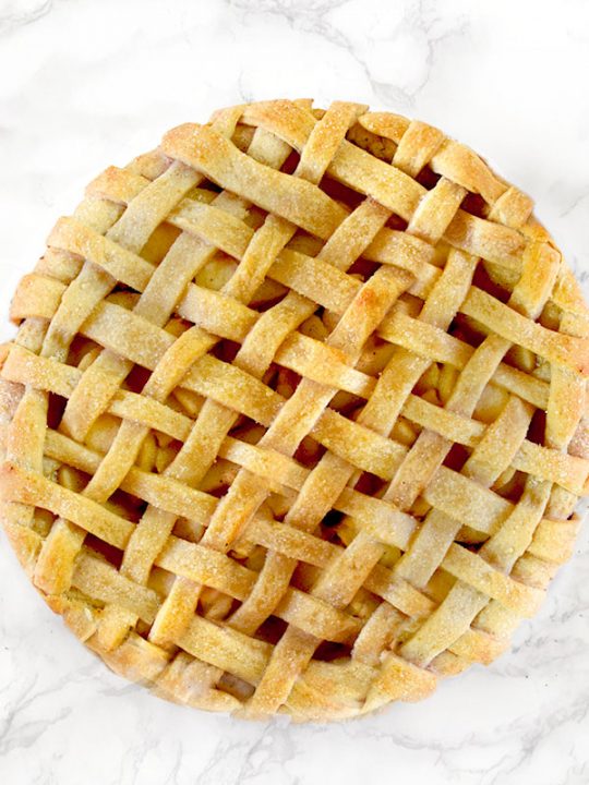 Dairy free apple pie on a white marble counter