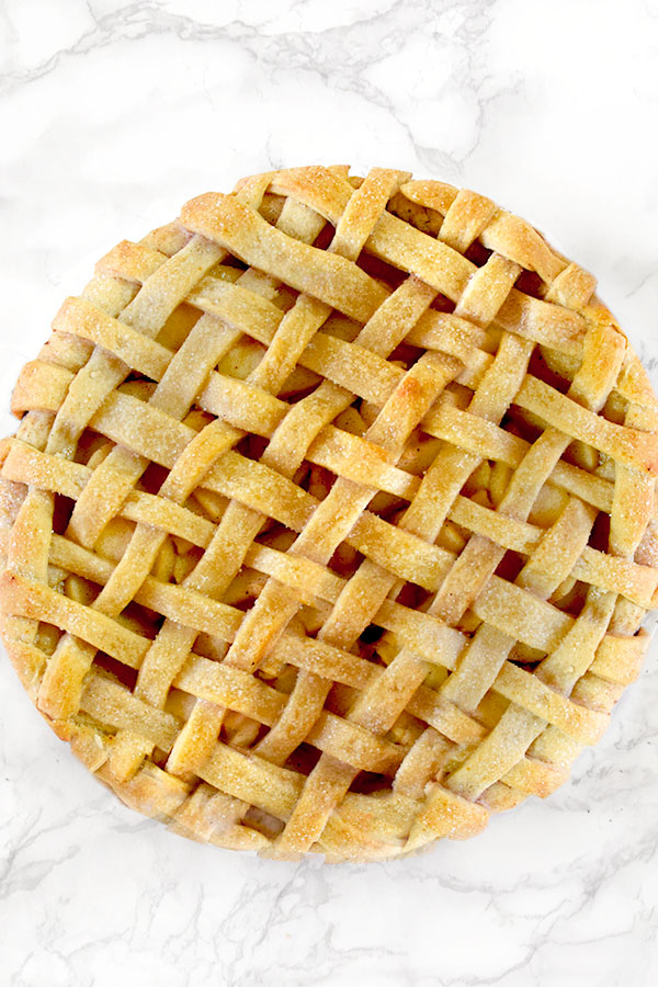 Dairy free apple pie on a white marble counter