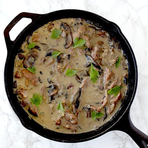 dairy free beef stoganoff using coconut milk in a cast iron skillet