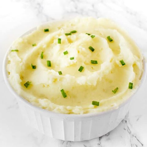 creamy dairy free mashed potatoes in a bowl on a white marble counter