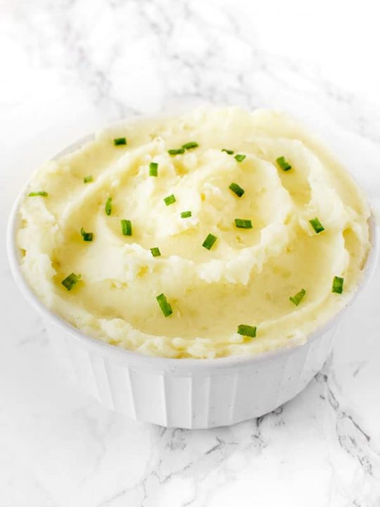 creamy dairy free mashed potatoes in a bowl on a white marble counter