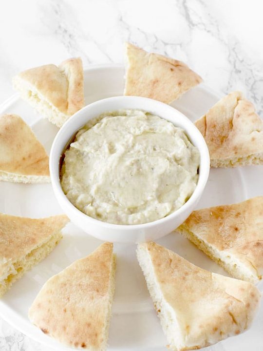 Baba Ghanoush on a plate with pita